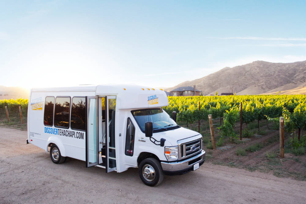 Discover Tehachapi Wine Tour busin front of vineyard